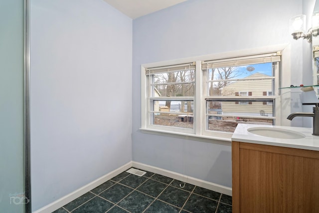 bathroom with tile patterned flooring and vanity