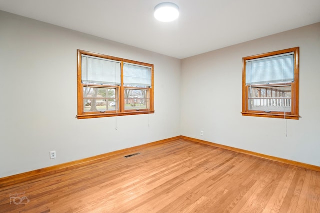 unfurnished room featuring light hardwood / wood-style flooring