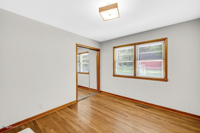 unfurnished room featuring light hardwood / wood-style floors