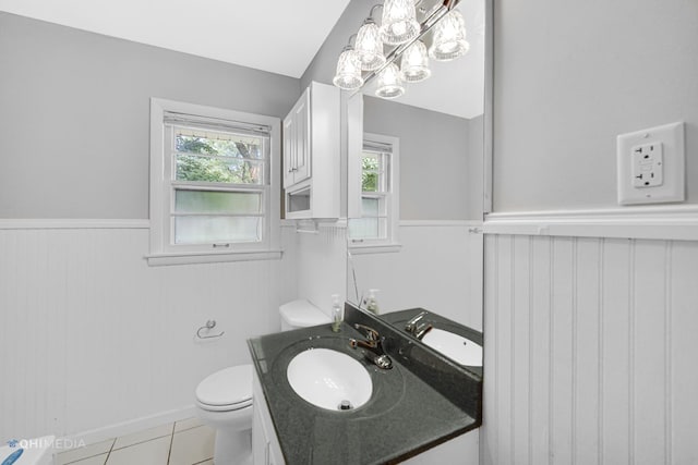 bathroom with tile patterned floors, vanity, and toilet