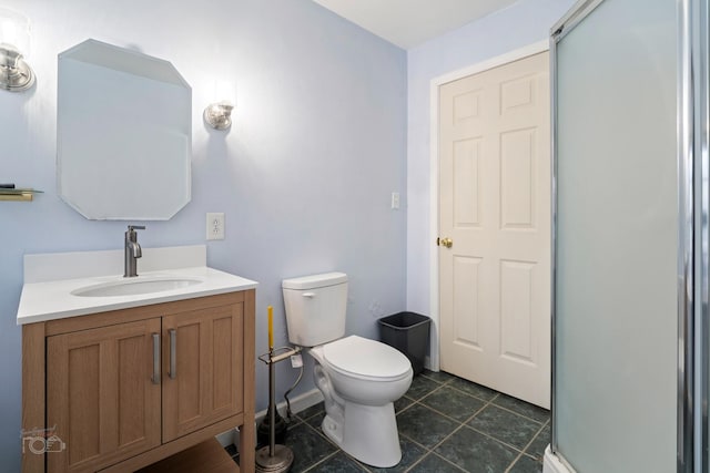 bathroom with toilet, vanity, tile patterned floors, and a shower with shower door