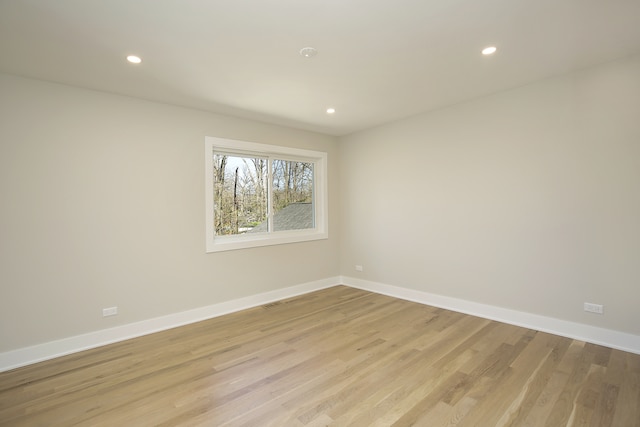 spare room with light wood-type flooring