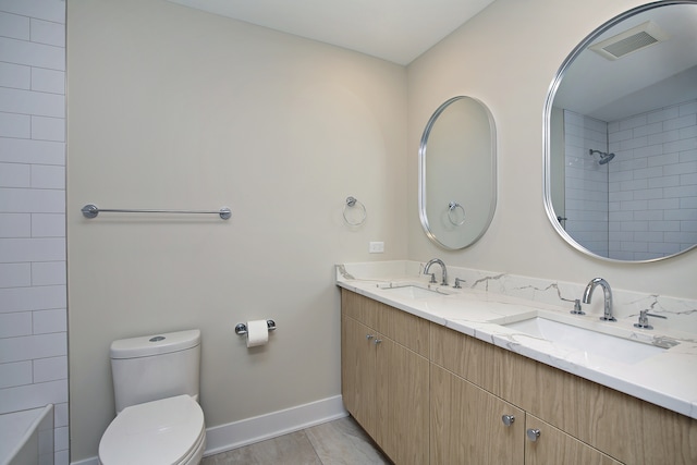 bathroom with hardwood / wood-style floors, vanity, and toilet