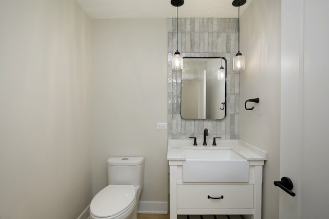 bathroom with vanity and toilet