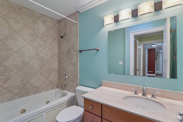 full bathroom featuring vanity, tiled shower / bath combo, and toilet