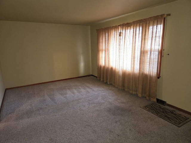 empty room with carpet flooring