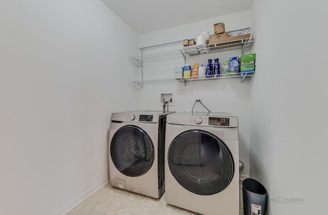 clothes washing area featuring washing machine and dryer