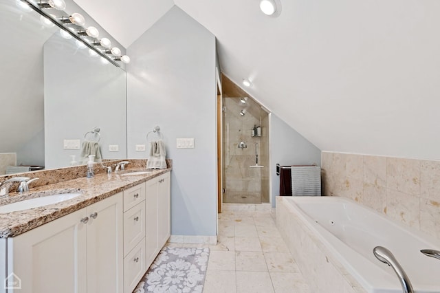 bathroom featuring plus walk in shower, vanity, and vaulted ceiling