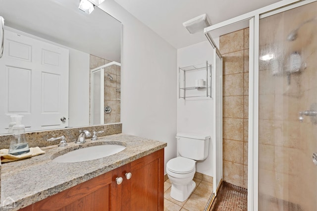 bathroom featuring walk in shower, tile patterned flooring, vanity, and toilet