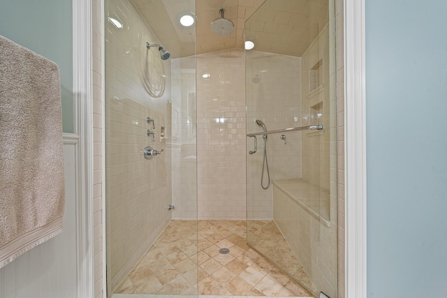 bathroom featuring an enclosed shower and lofted ceiling