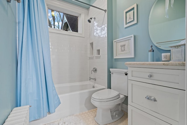 full bathroom with vanity, toilet, and shower / bath combo with shower curtain