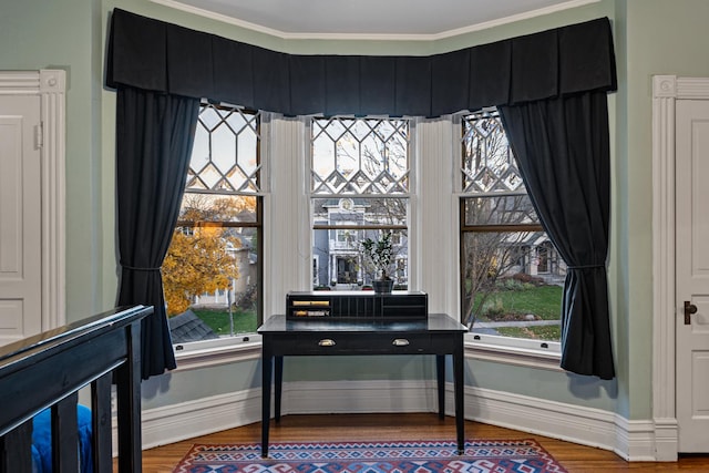 misc room featuring hardwood / wood-style floors and crown molding