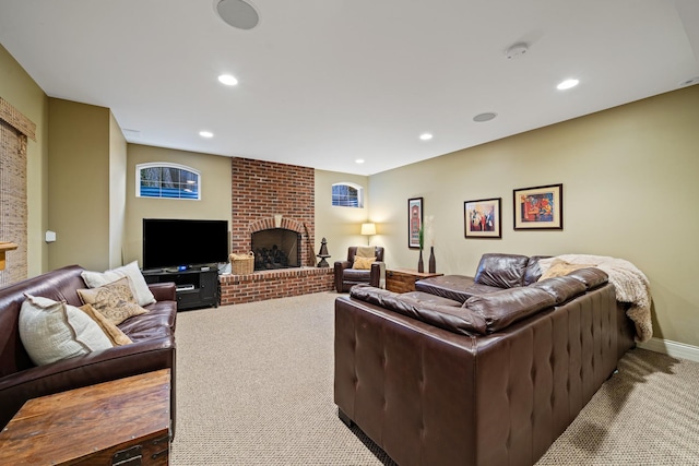 carpeted living room with a brick fireplace