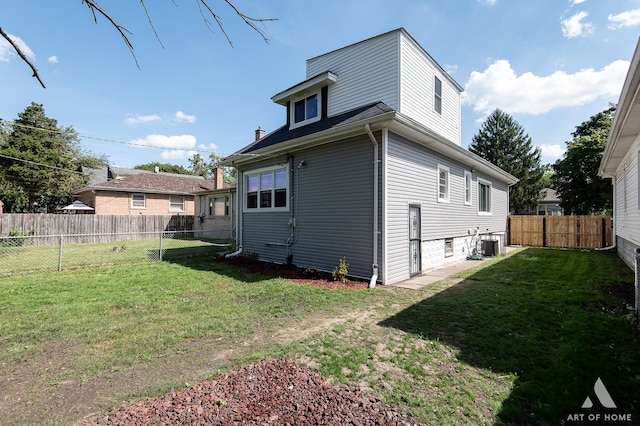 exterior space featuring central AC and a lawn