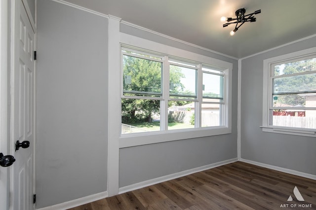 unfurnished room with dark hardwood / wood-style floors and ornamental molding