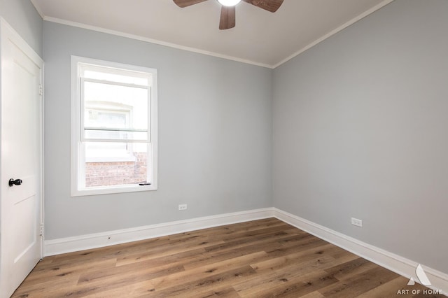 spare room featuring hardwood / wood-style floors, ceiling fan, and crown molding