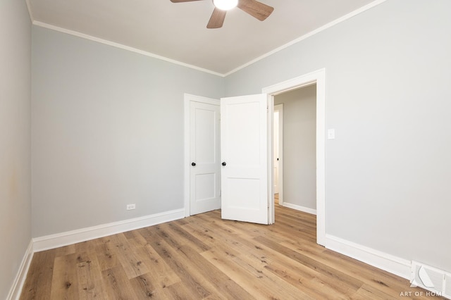 spare room with ceiling fan, light hardwood / wood-style floors, and ornamental molding