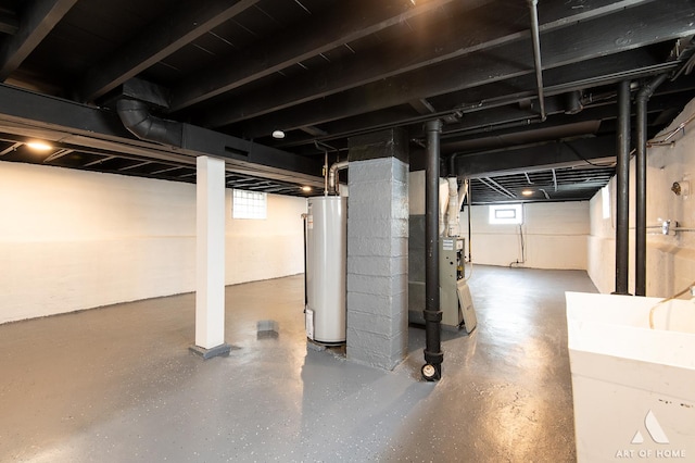 basement with gas water heater and sink