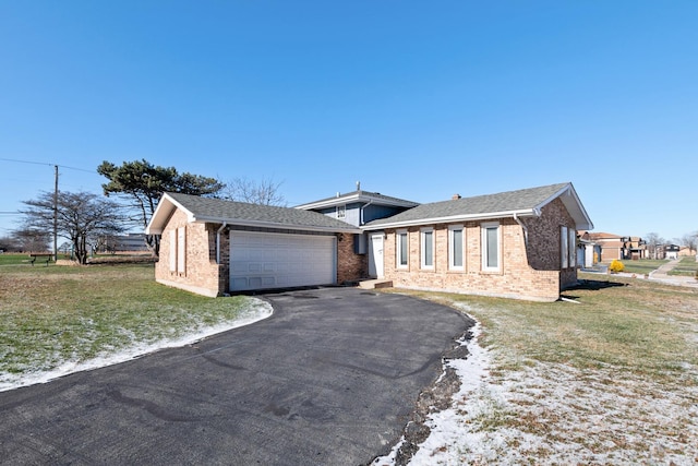 ranch-style house with a front yard and a garage