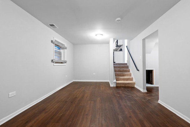 basement featuring dark hardwood / wood-style floors