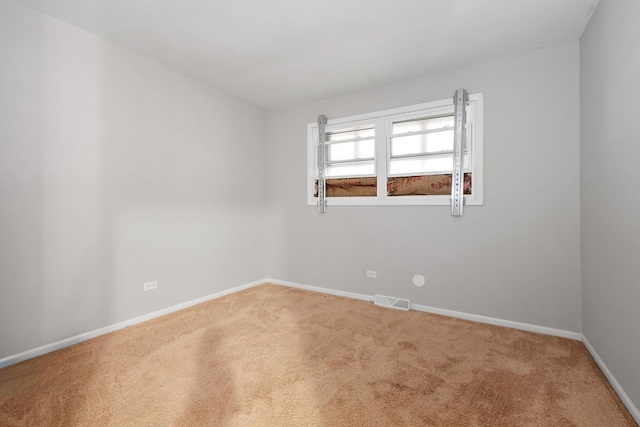 spare room with carpet floors