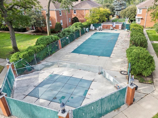 view of swimming pool with a patio area