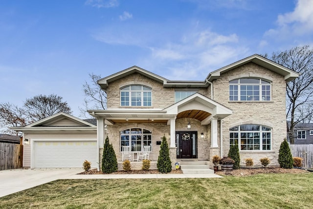 view of front of house with a garage and a front lawn