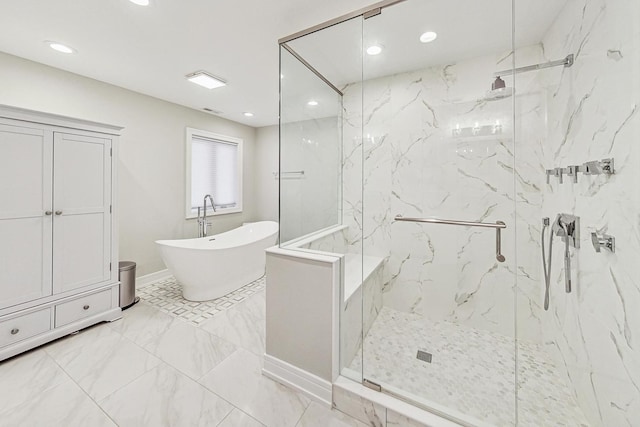 bathroom featuring separate shower and tub