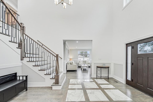 entrance foyer featuring a chandelier