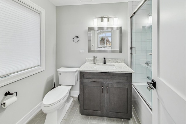 full bathroom featuring shower / bath combination with glass door, vanity, toilet, and tile patterned flooring