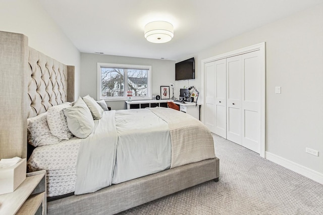 carpeted bedroom featuring a closet