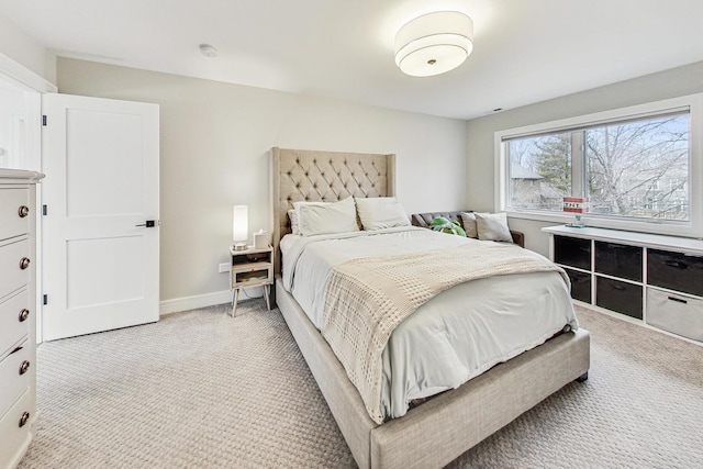 bedroom featuring light colored carpet