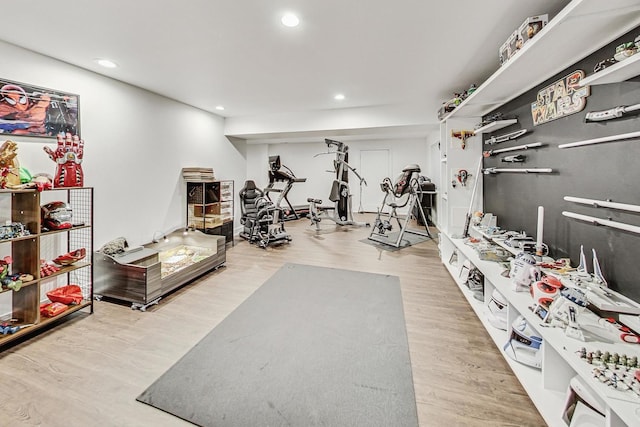 workout room with hardwood / wood-style flooring