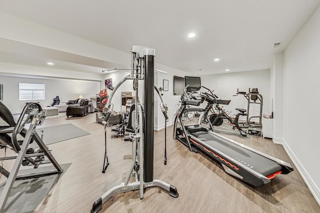 exercise area with light hardwood / wood-style floors