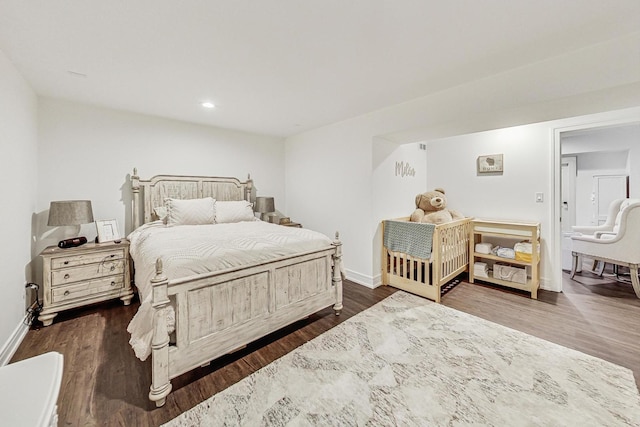 bedroom featuring dark hardwood / wood-style flooring