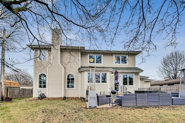 back of house featuring a yard, an outdoor hangout area, and a patio area