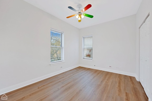 spare room featuring ceiling fan and light hardwood / wood-style flooring