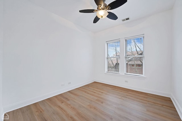 empty room featuring light hardwood / wood-style flooring and ceiling fan