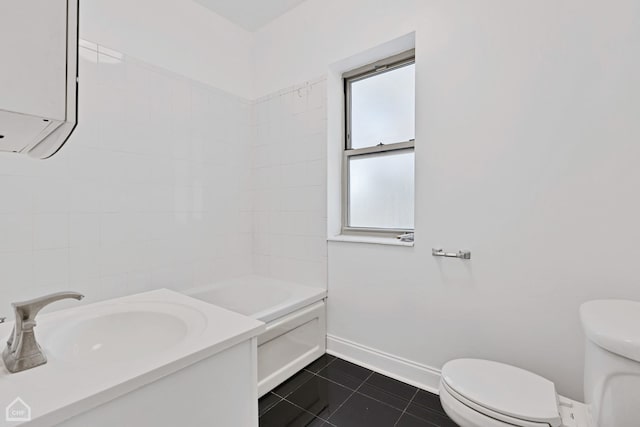 full bathroom featuring tile patterned floors, vanity, toilet, and tiled shower / bath