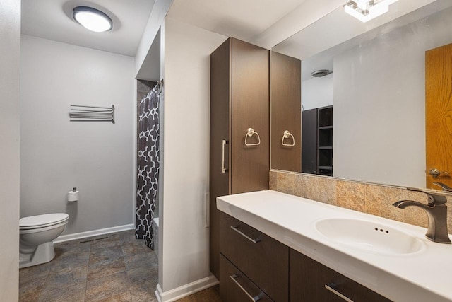 full bathroom featuring shower / bath combination with curtain, vanity, and toilet