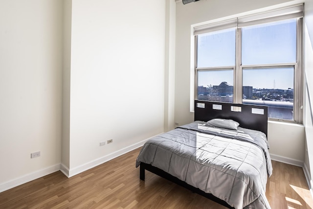 bedroom featuring hardwood / wood-style flooring