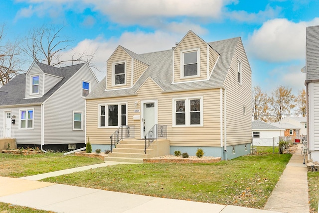 cape cod home with a front yard