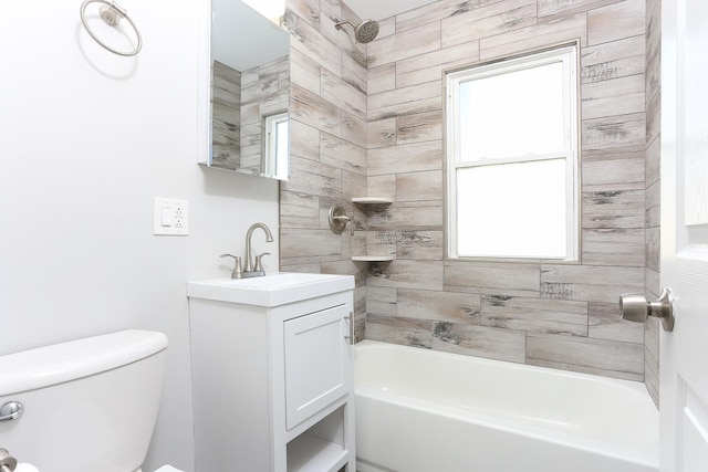 full bathroom featuring vanity, toilet, and tiled shower / bath