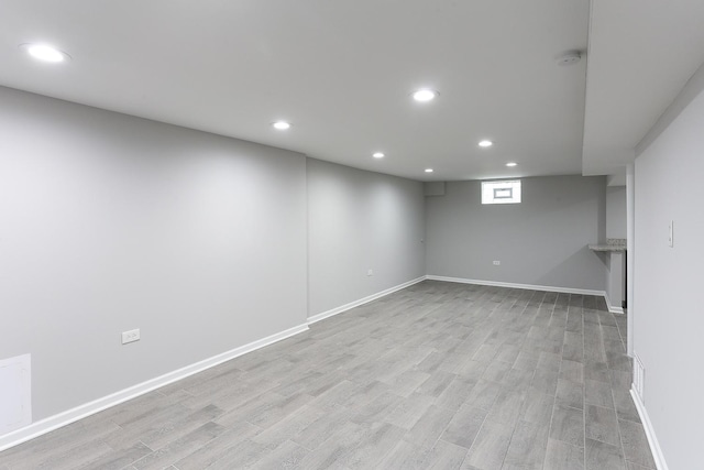 basement featuring light hardwood / wood-style flooring