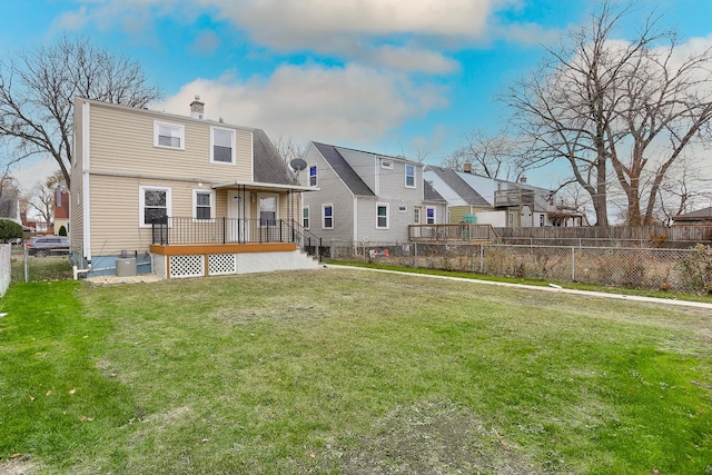 rear view of house with a lawn