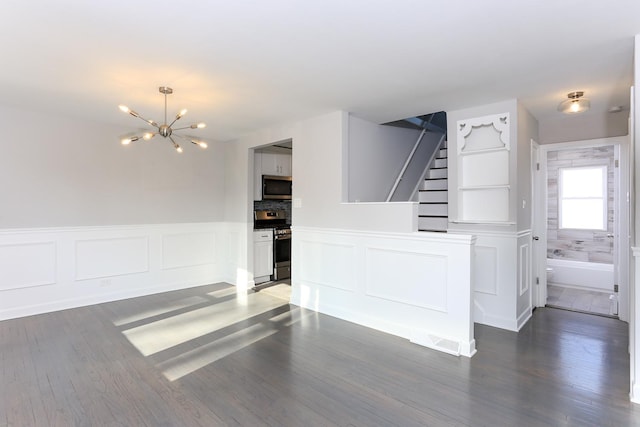 interior space with a chandelier and hardwood / wood-style flooring