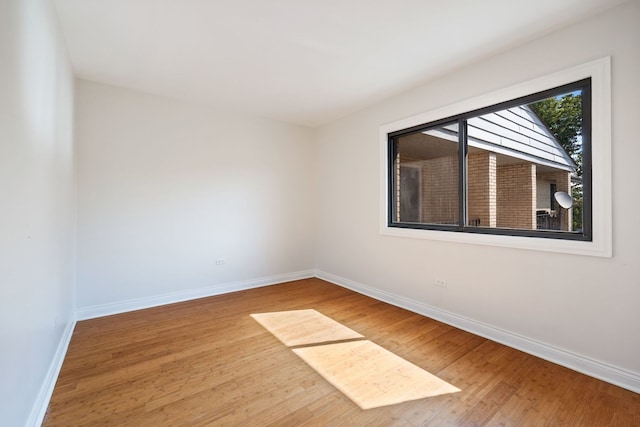 spare room featuring hardwood / wood-style flooring