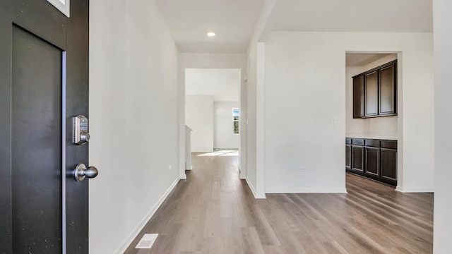 entrance foyer with light hardwood / wood-style flooring