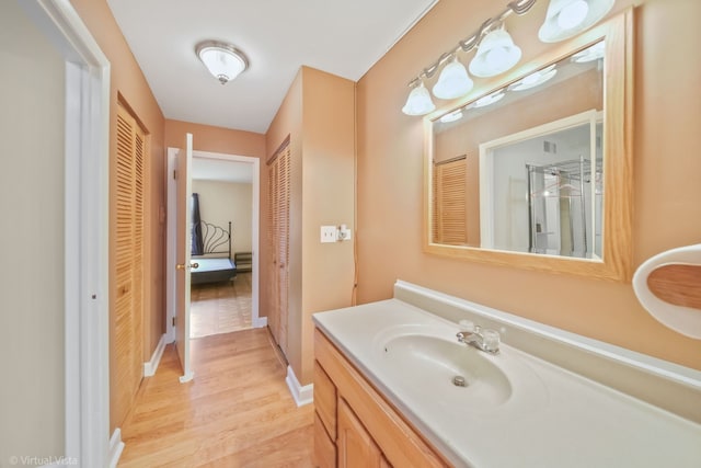 bathroom featuring vanity and wood-type flooring