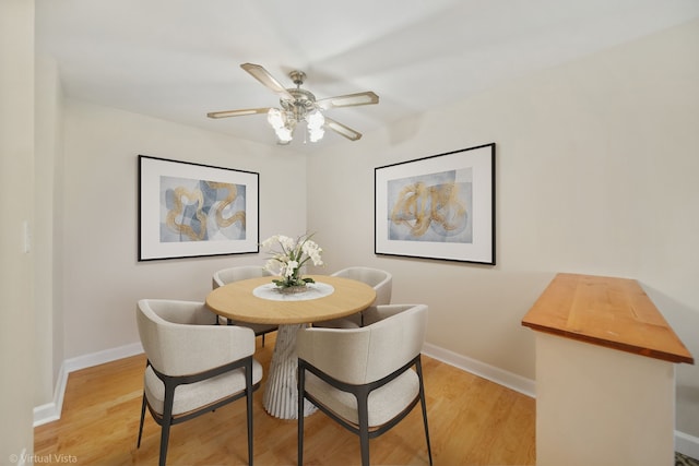 dining space featuring ceiling fan and light hardwood / wood-style floors